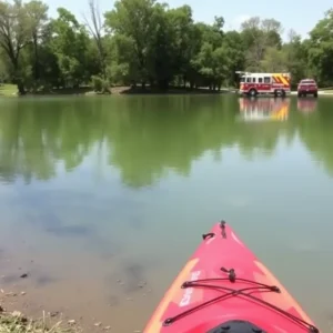 Rescue scene at a pond in Oklahoma City with emergency responders