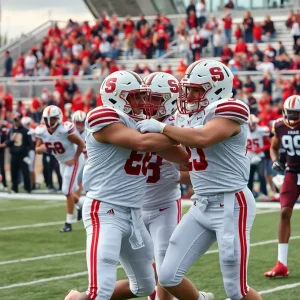 Oklahoma Sooners players in action during a football game