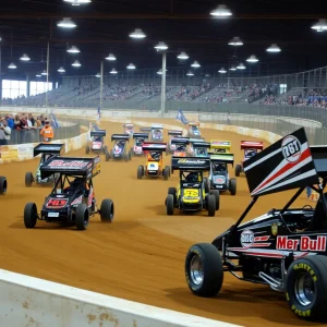 Indoor dirt racing action at the Tulsa Shootout with multiple cars racing