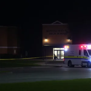 Police and ambulance at a shooting scene near Douglass High School