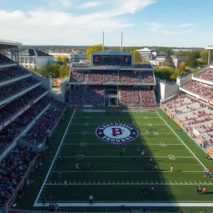 Aerial view of a university stadium during an athletic event with students and fans.