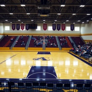Empty fan section in a high school basketball gym